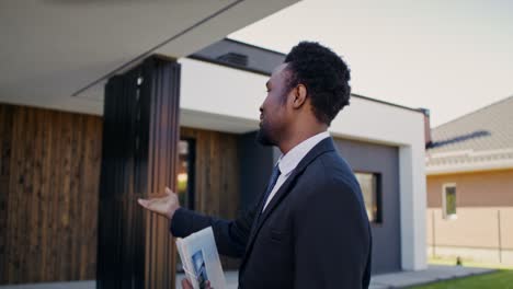 real estate agent showing modern house