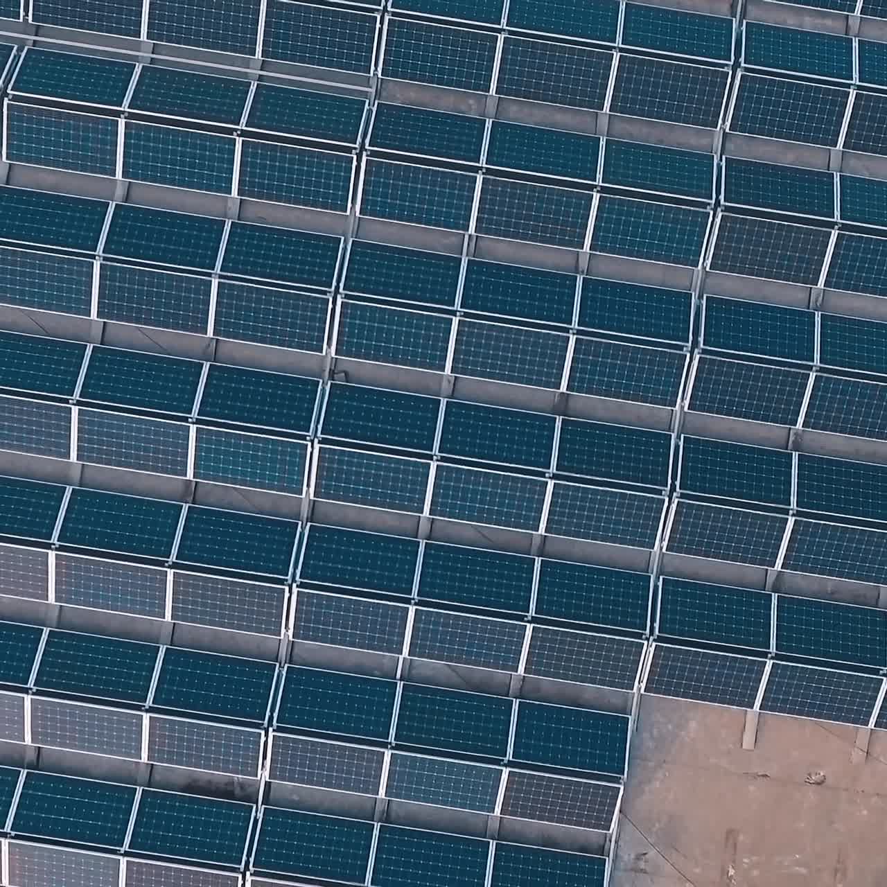 Top view on blue solar panels. Innovative photovoltaic system. Production of clean energy. Alternative energy sources. Aerial view.