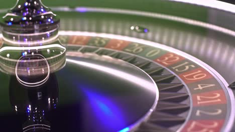 metallic roulette wheel spinning, green surface catching white ball, dramatically landing on random number during intense gambling moment