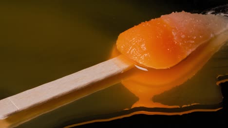 close up shot of a rocket popsicle with a chopstick melting time lapse