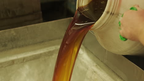 oil pouring into a container