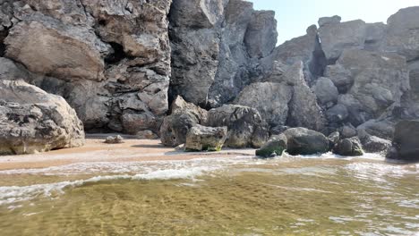rocky coastline with beach and sea