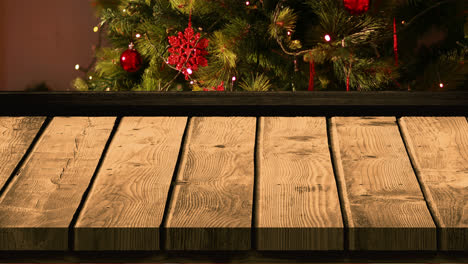 Wooden-foreground-with-Christmas-background-of-tree