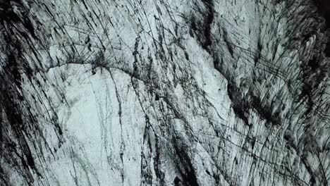 aerial top view of the textured ice of sólheimajökull glacier, iceland, during summer