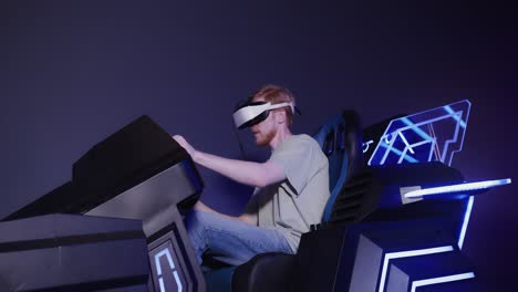 man wearing vr headset in a driving simulator