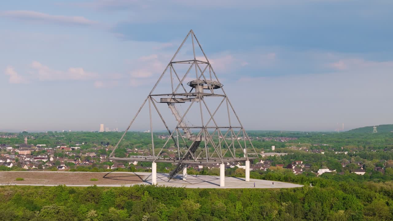 Drone circles around The Tetrahedron steel structure art installation in Bottrop