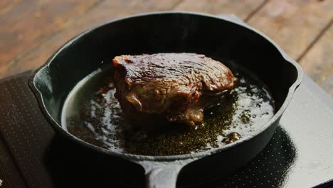 Skillet-with-fried-meat-on-stove