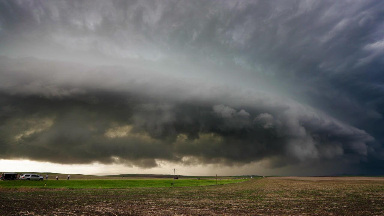 Awesome dark storm clouds roll across dramatic sky 4K timelapse