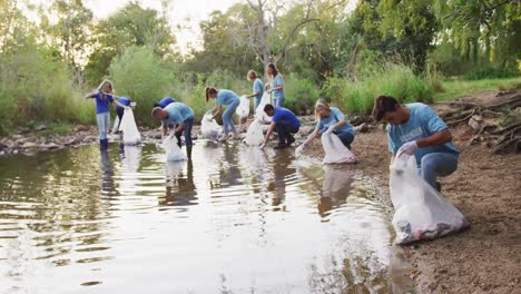 mid adults volunteering during river clean-up day