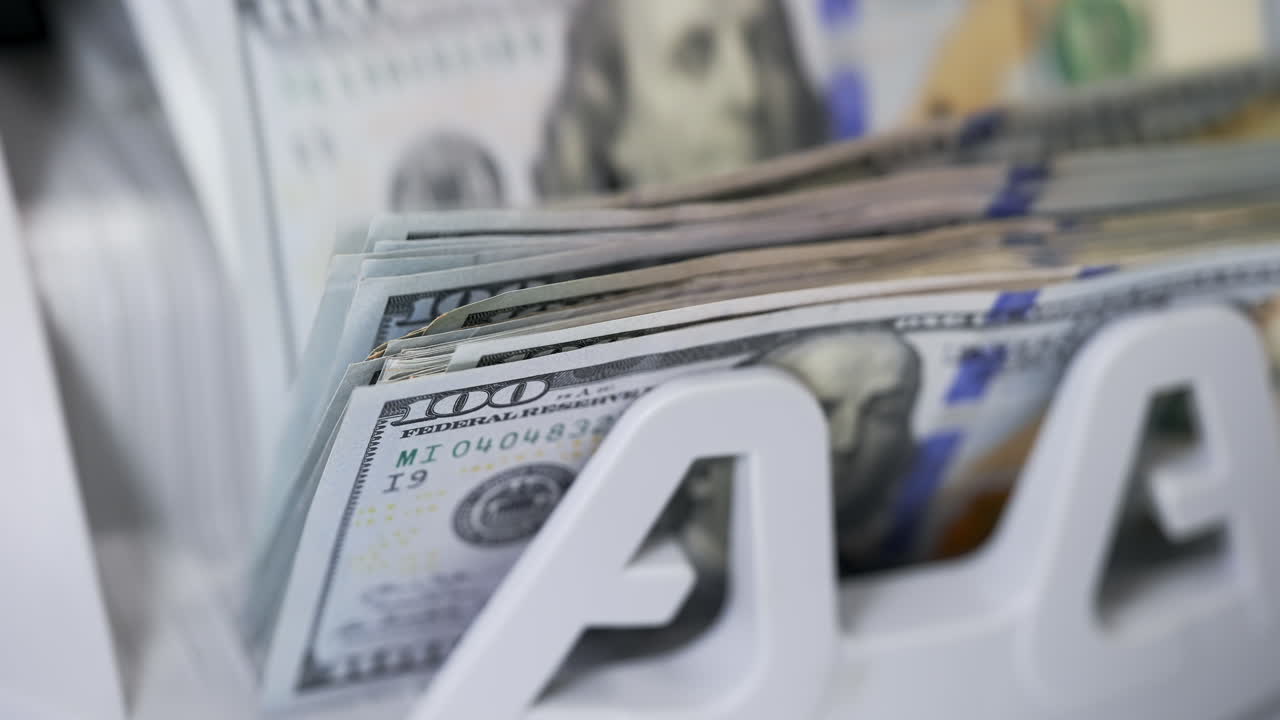 US dollar banknote in counting machine. Automatic mechanism for bank financial operations.