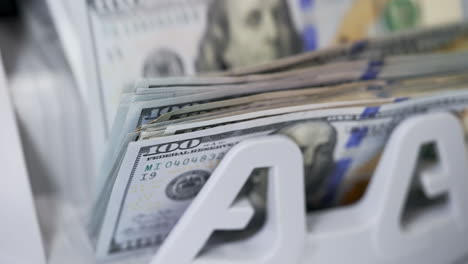 us dollar banknote in counting machine. automatic mechanism for bank financial operations.