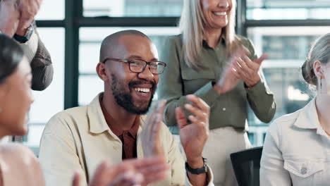 business team clapping in office celebrating success