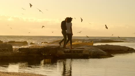 couple having fun on the beach 4k
