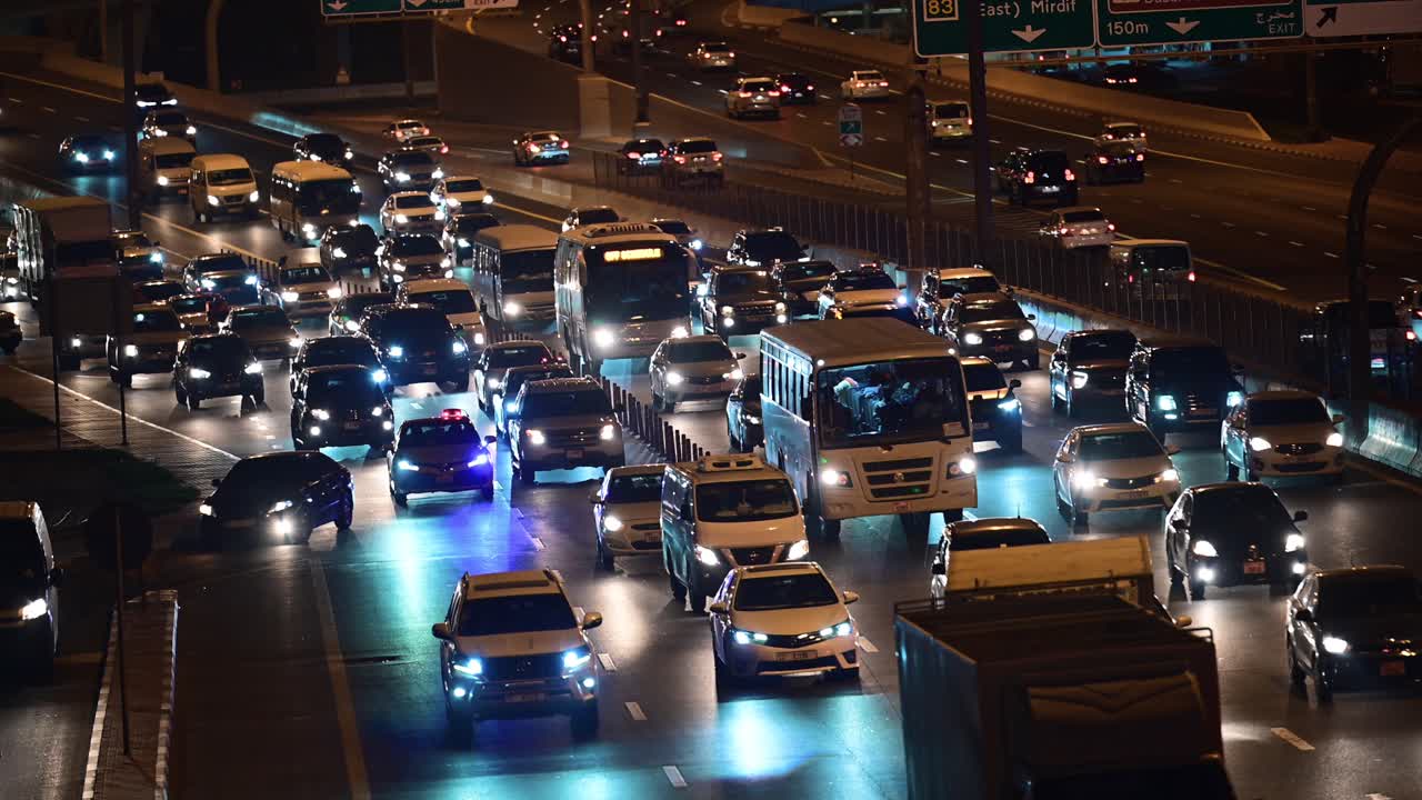 Slow-moving evening traffic in Dubai, heading towards Sharjah, United Arab Emirates.