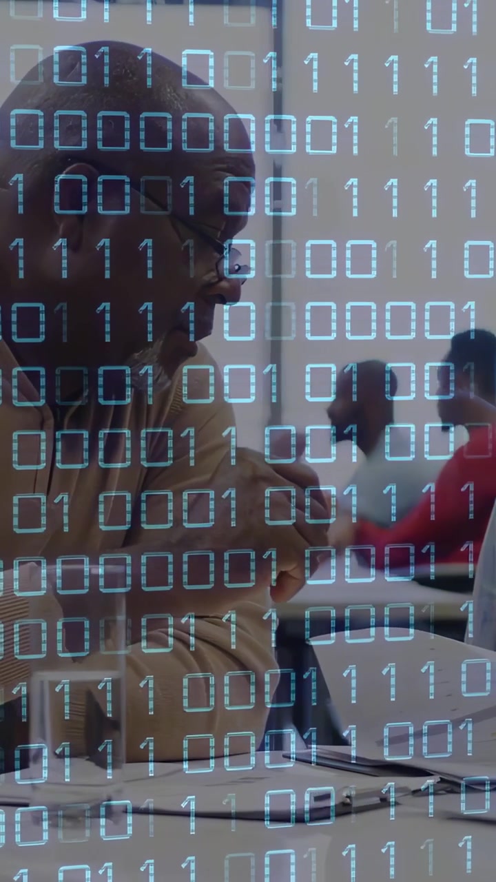 Vertical video: Senior reading notes, leaning and reaching tablet under binary overlay for training