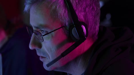 caucasian man typing on computer keyboard in a creative office