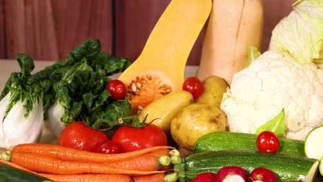 assorted vegetables displayed on a wooden surface