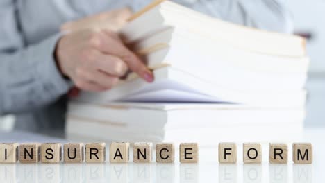 stack of documents with insurance forms closeup