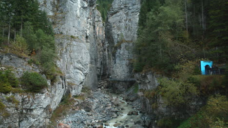 famous tourist viewpoint of ice caves in alps in front of climber entry point in grindelwald switzerland, europe