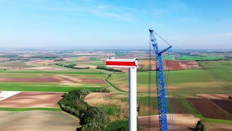 Construction-Of-A-Windmill-In-Scenic-Wind-Farm---aerial-shot