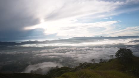 Push-in-shot-of-a-tropical-foggy-hilltop-view