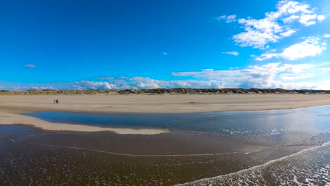 Aerial:-Small-Ocean-Waves-Washing-Sandy-Shore