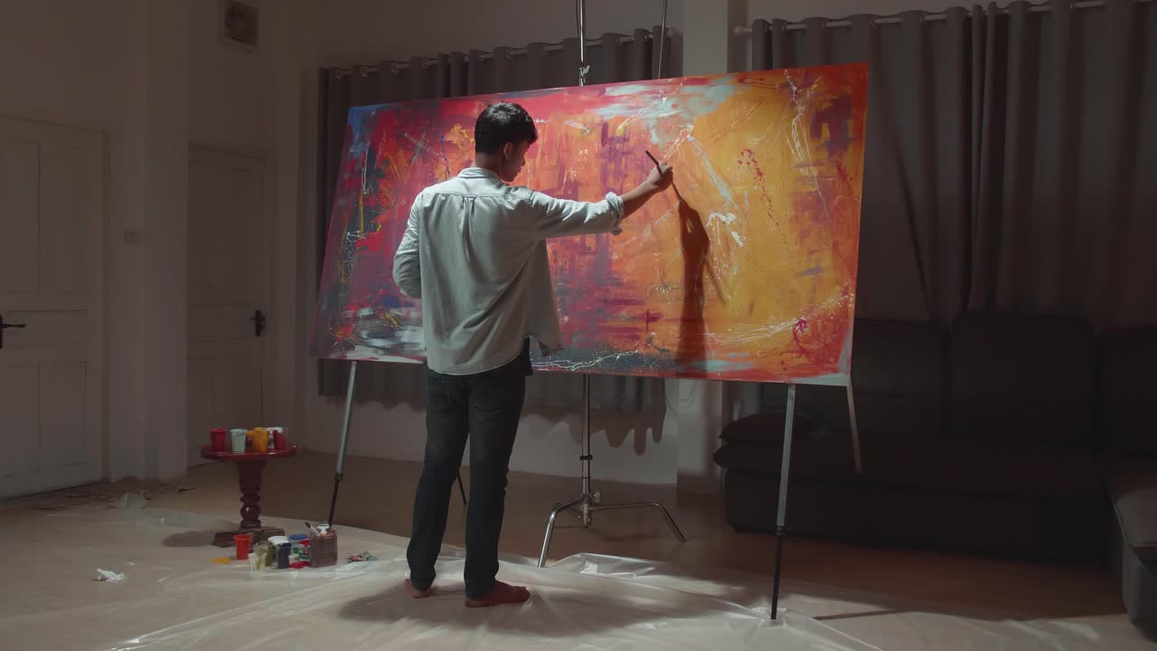Male Artist Energetically Draws With Paint Brush, He Creates Modern Masterpiece Of The Painting