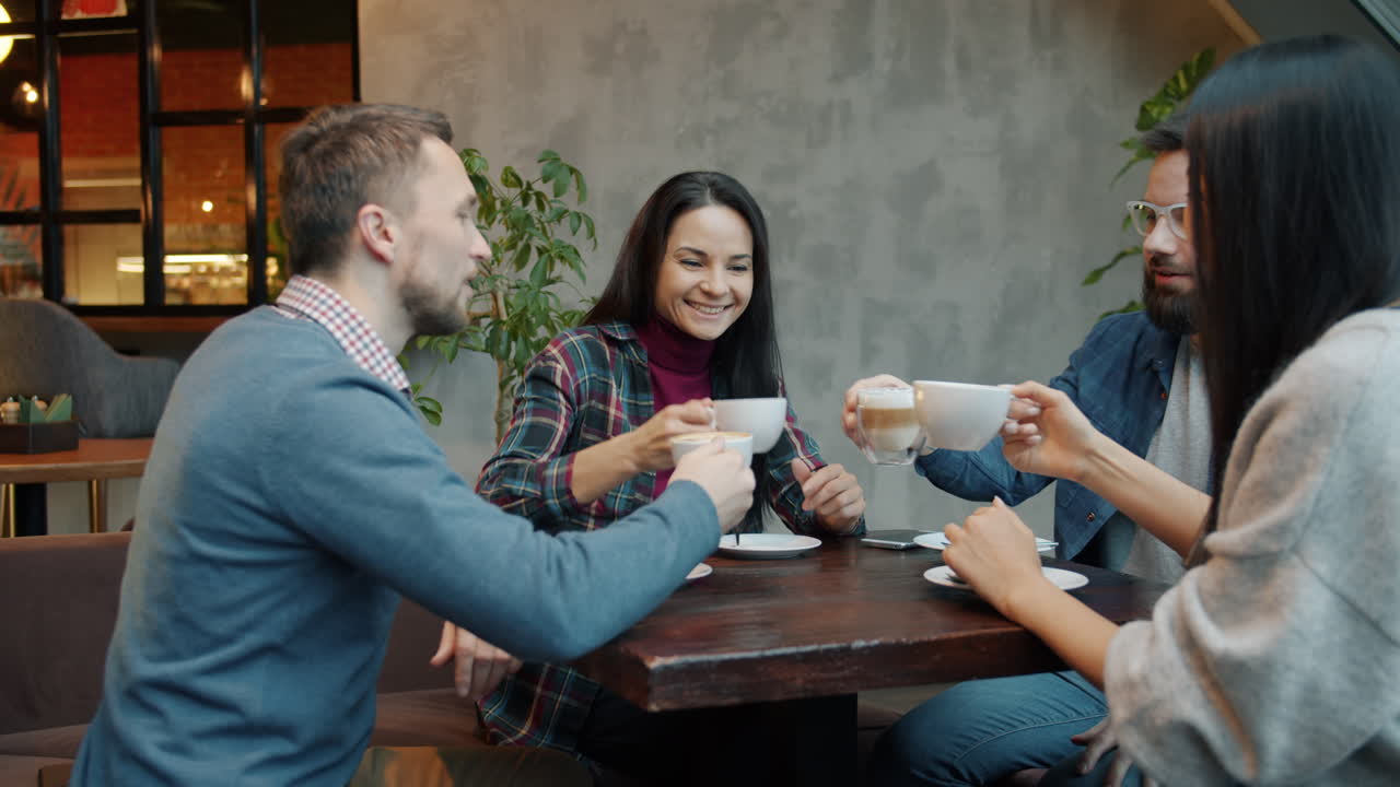 Friends Enjoying Coffee at a Cafe