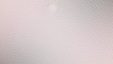 hexagonal pattern on the surface of uyuni salt flat as a result of salt crystallization. - aerial overhead shot