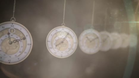 Spot-of-light-against-multiple-hanging-clocks-ticking-against-dark-background