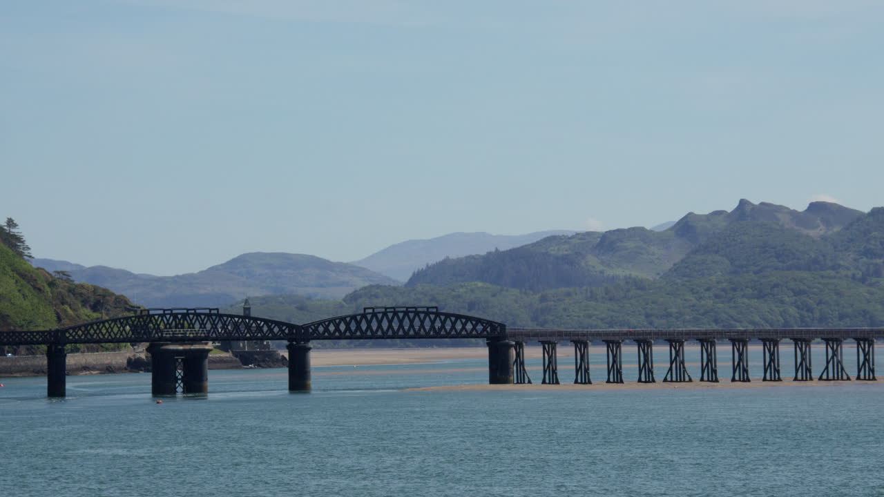 wide shot looking up the Mawddach estuary to Barmouth rail bridge