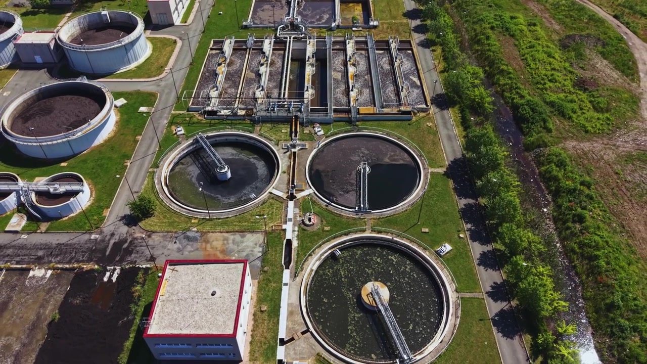 Drone captures sewage facility details. Unmanned aerial photography reveals sewage facility infrastructure emphasizing ecological sustainability and monitoring systems