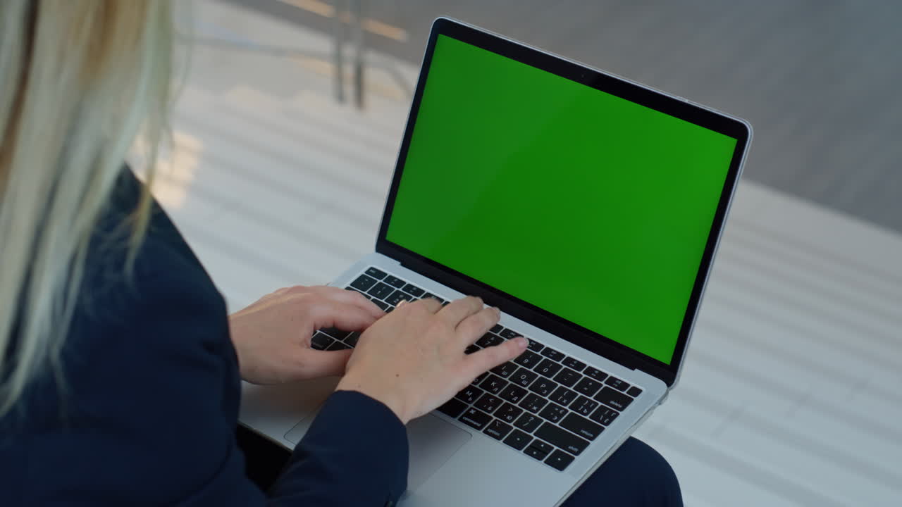 Entrepreneur hands typing mockup laptop on knees closeup. Unknown businesswoman
