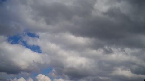 blue sky with white fluffy cumulus clouds. rapid movement of clouds in the air. timelapse