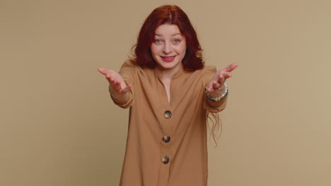 woman with red hair smiling and welcoming with open arms