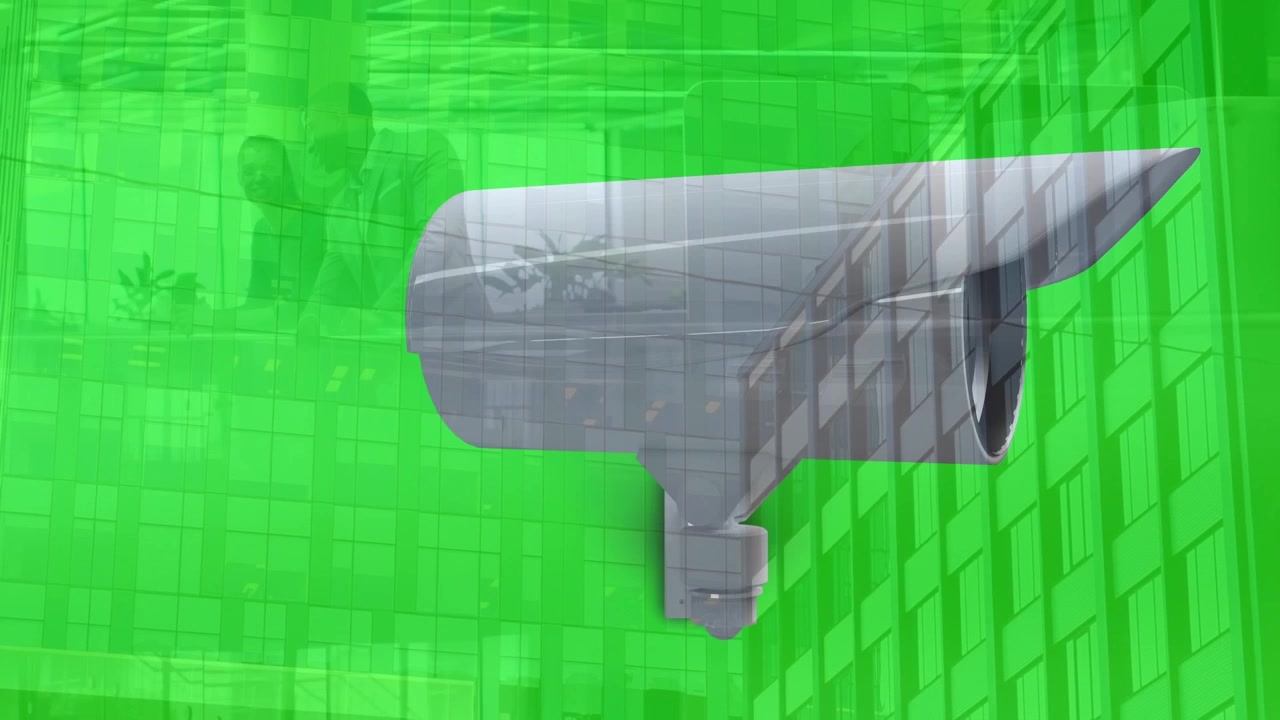 Animazione di telecamera CCTV che si muove su un ufficio e un edificio per uffici su sfondo verde.