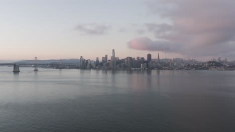 dawn aerial pullback expansive view of san francisco skyline