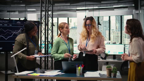 vertical video determined team of professional women assembling to review charts