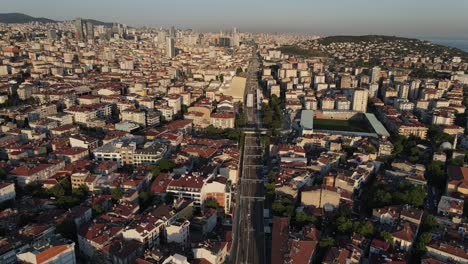 Aerial-Landscape-Of-Train-Above-City-Road