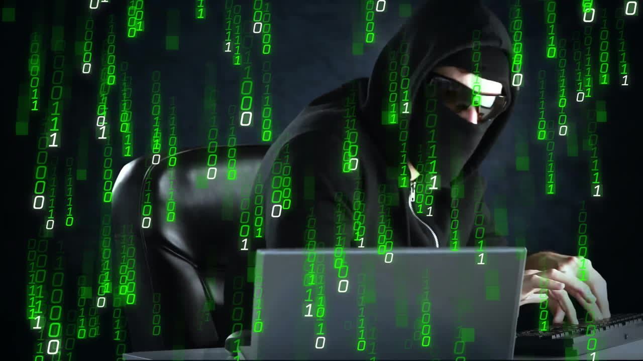 Hacker in hoodie using laptop over green binary code animation