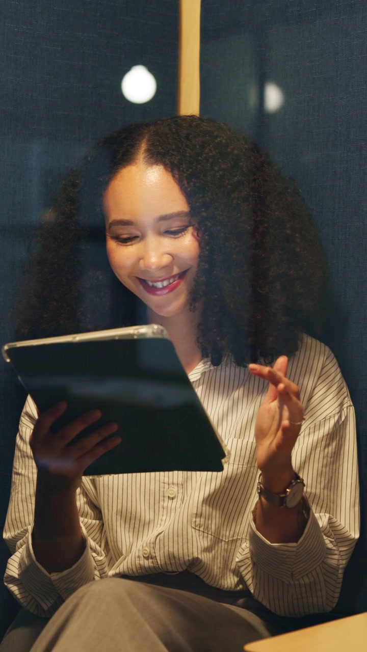 Young Woman Using a Tablet in a Modern Office Workspace