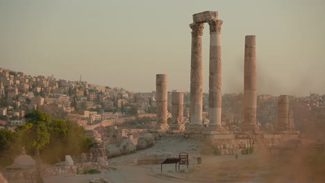 an establishing shot of amman jordan with roman ruins foreground