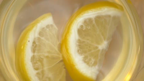 close-up of lemon slices in a glass of water