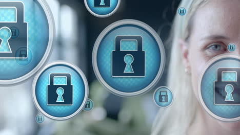 animation of padlock icons data processing over caucasian businesswoman in office