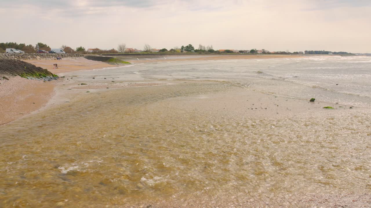 Coastal landscape with shallow water on an overcast day