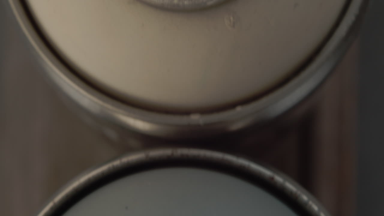 Top Sliding View Of Messy Used Spray Paint Cans. close up