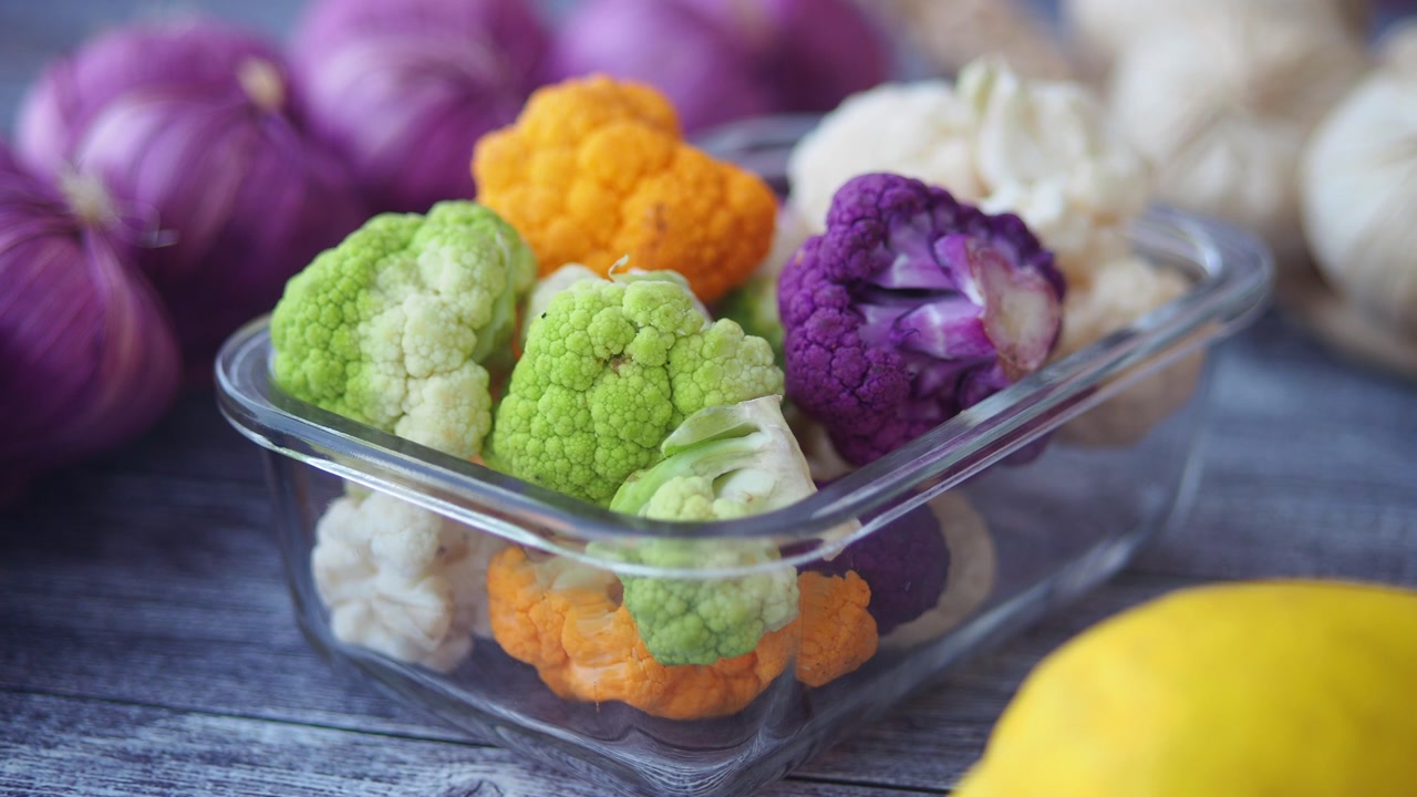 Colorful Fresh Cauliflower Florets in a Glass Container