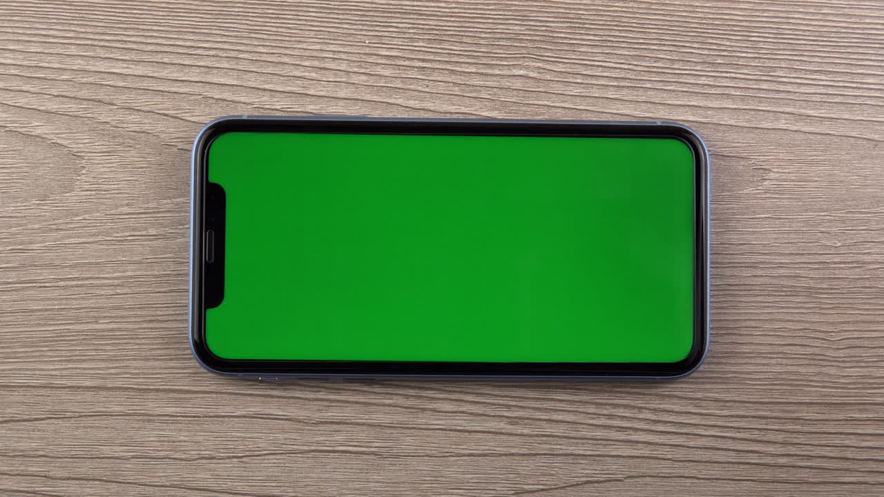 Smartphone with green screen mockup, zoom, hand close up, mobile phone user
