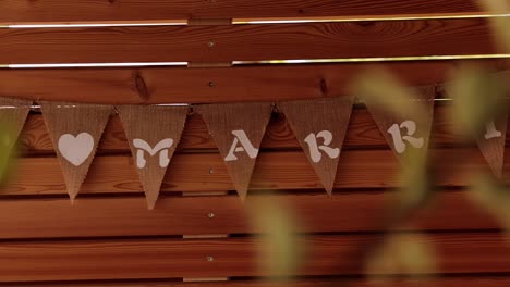 flags hung on the wall with the inscription just married