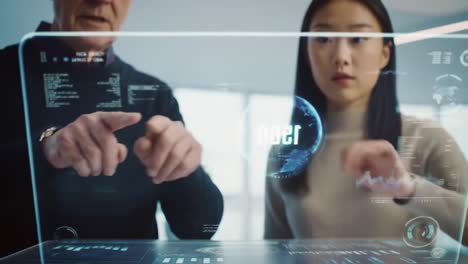 Two Individuals Engaging with an Interactive Holographic Interface, Analyzing Digital Data and Visualizations in a Modern Workspace Setting